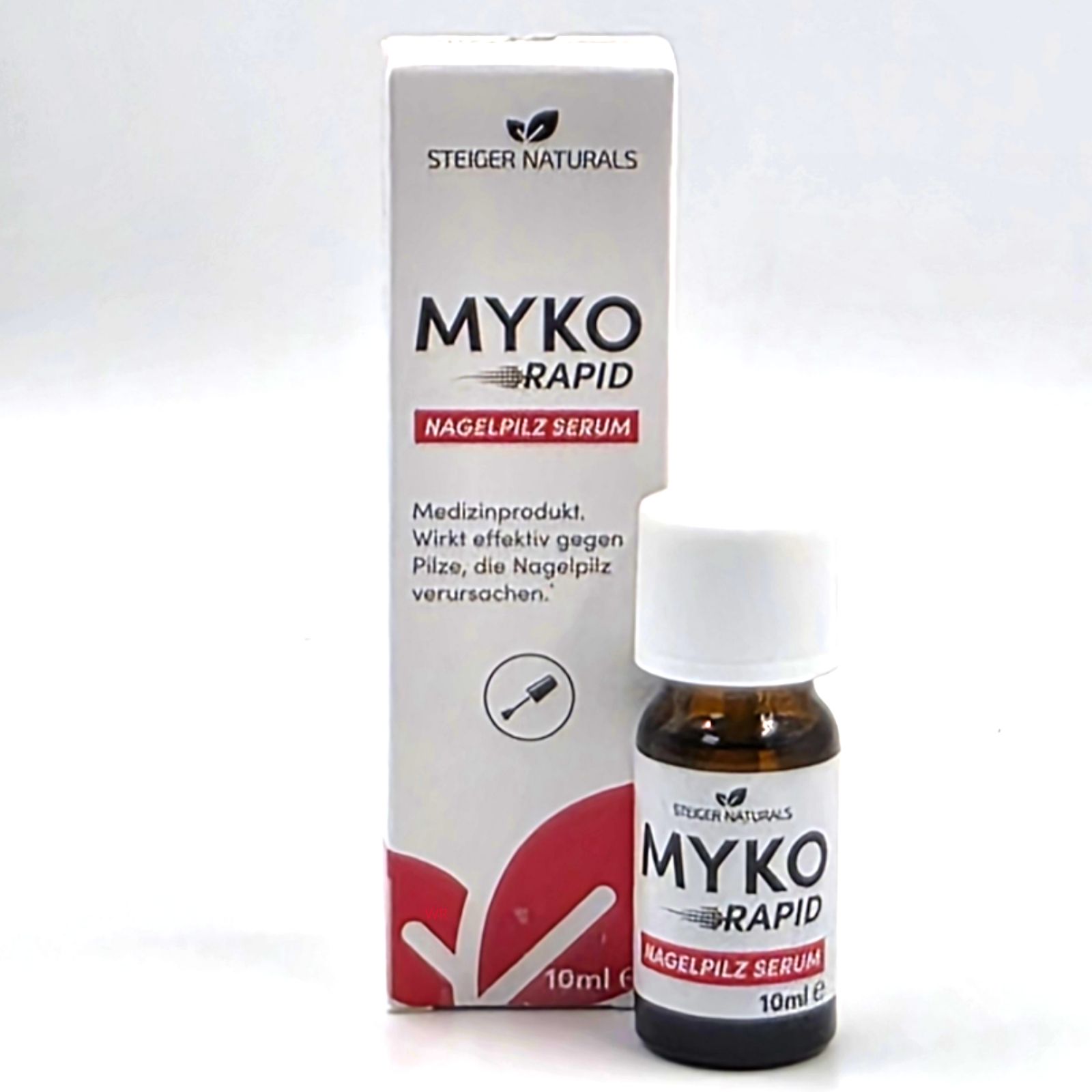 Produktflasche und Schachtel mit MYKO RAPID Nagelpilz Serum. Braune Flasche, weißer Deckel. Schachtel: rot und weiß. 10ml.