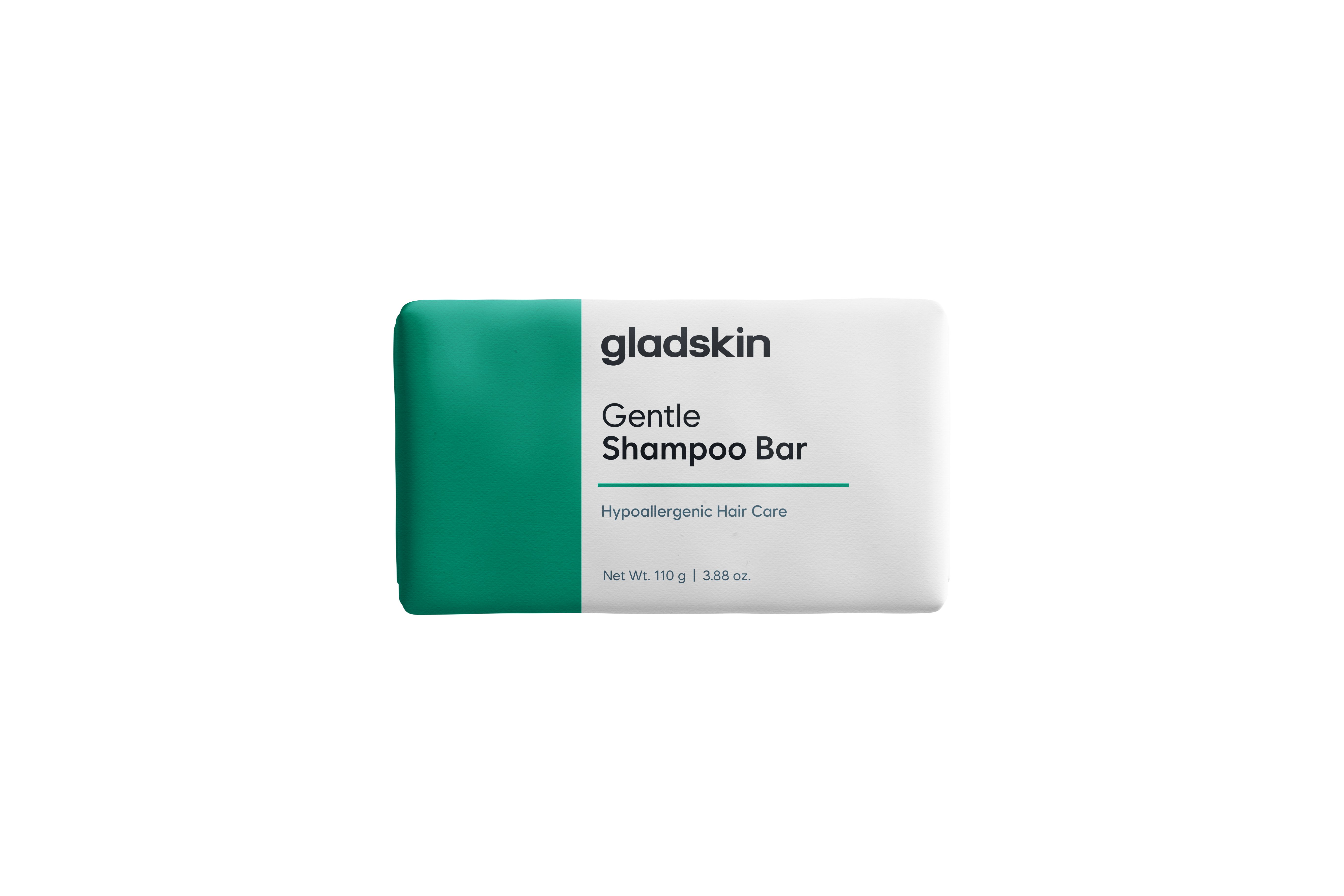 Rechteckige Verpackung mit grünem Akzent. Aufschrift: "gladskin Gentle Shampoo Bar". Hypoallergene Haarpflege.