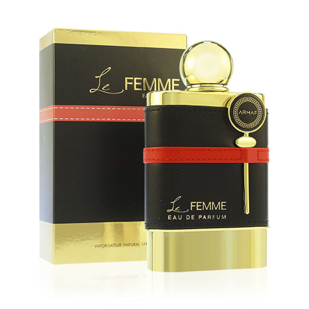 Goldfarbener Flakon mit schwarzem Lederband und rotem Streifen. Schwarze Verpackung mit goldener Schrift. Aufschrift: Le Femme.