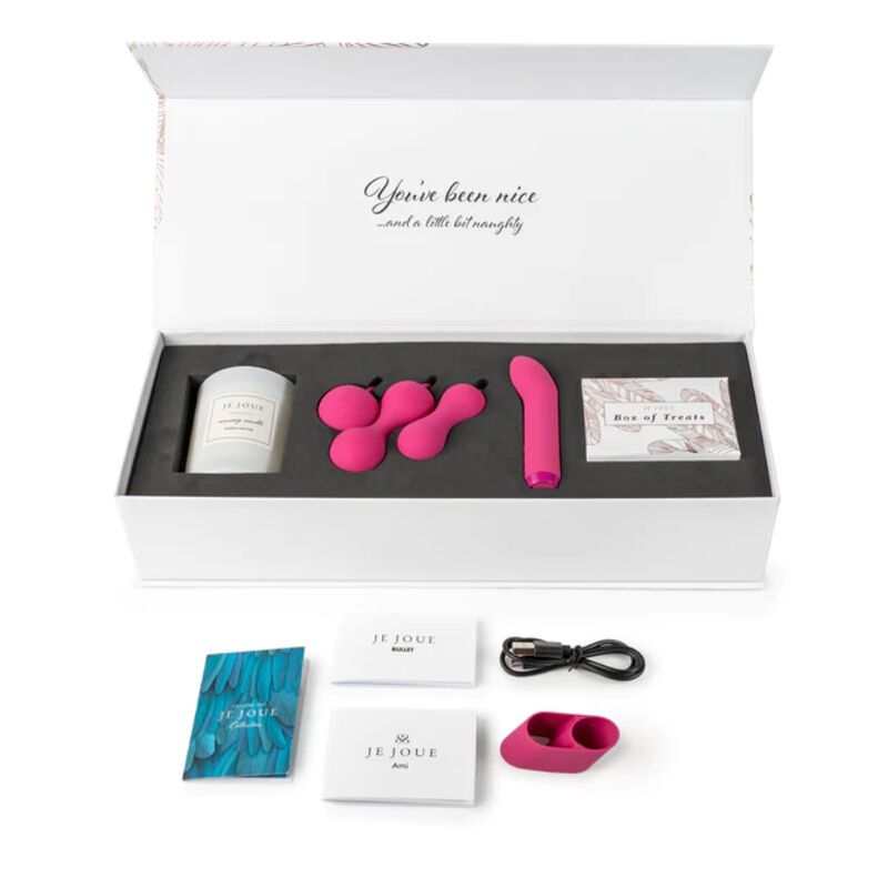 Geöffnete Geschenkbox mit Kerze, Kegel-Übungsbällen, Vibrator und Karten.