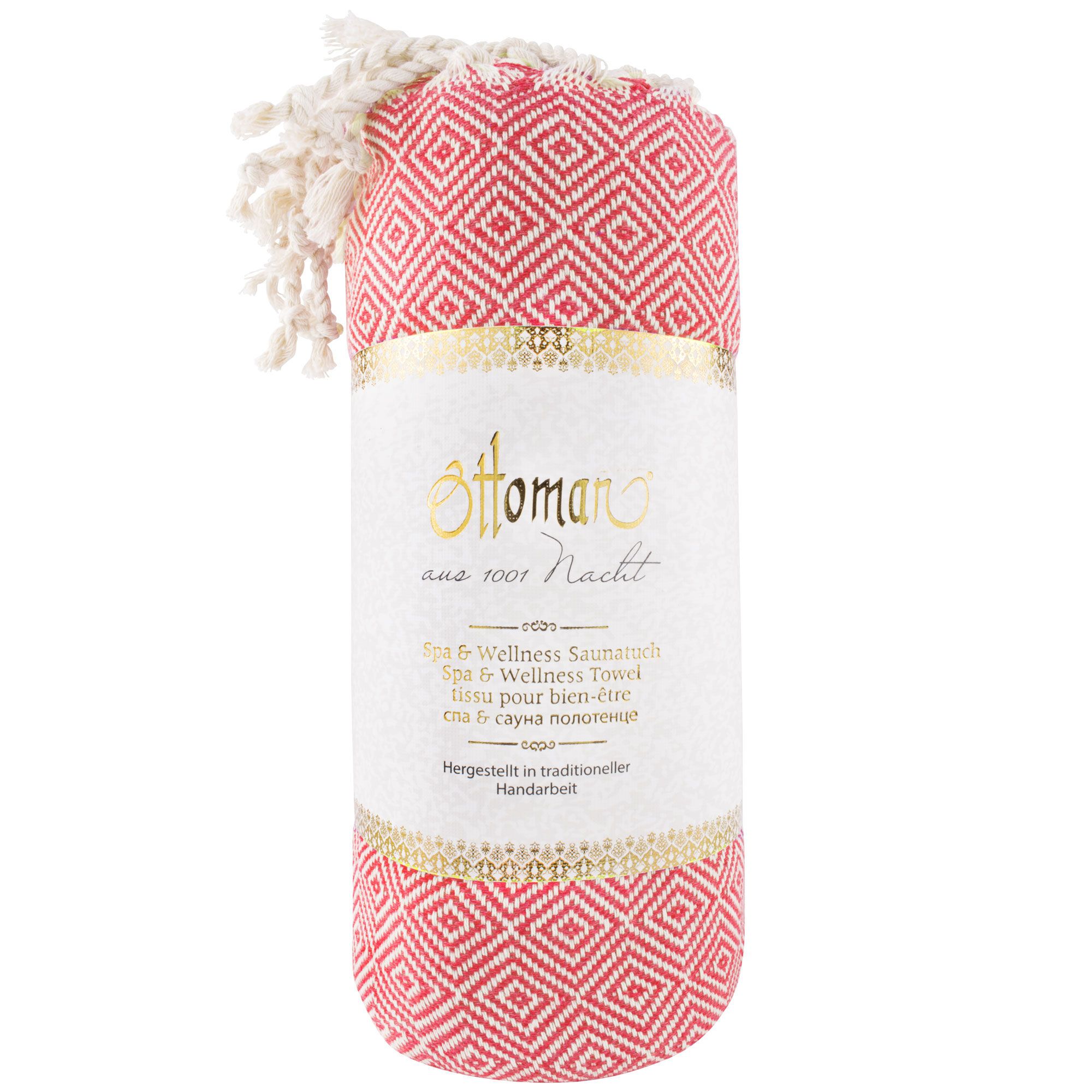 Gerolltes Hamam-Tuch mit Rautenmuster in Pink und Weiß. Mit Fransen. Aufgedrucktes Etikett mit Text in mehreren Sprachen.