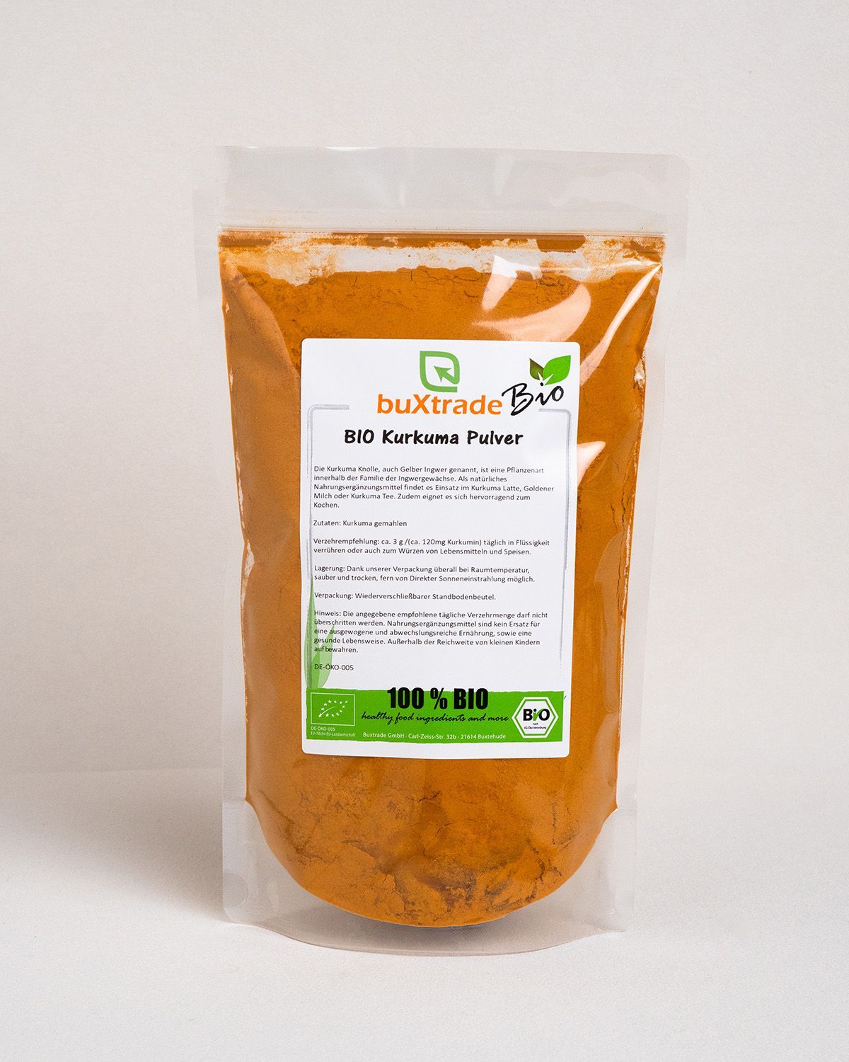 Transparenter Beutel mit buXtrade Bio Kurkuma Pulver. Gelbes Pulver sichtbar. Aufschrift: BIO Kurkuma Pulver, 100% BIO.