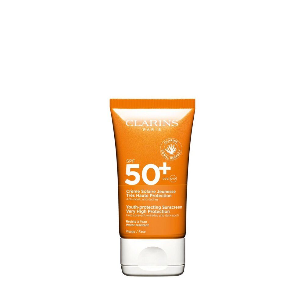 Orange Tube mit weißem Deckel. Text: Clarins Paris, SPF 50+, Crème Solaire Jeunesse, Très Haute Protection, Wasserfest.