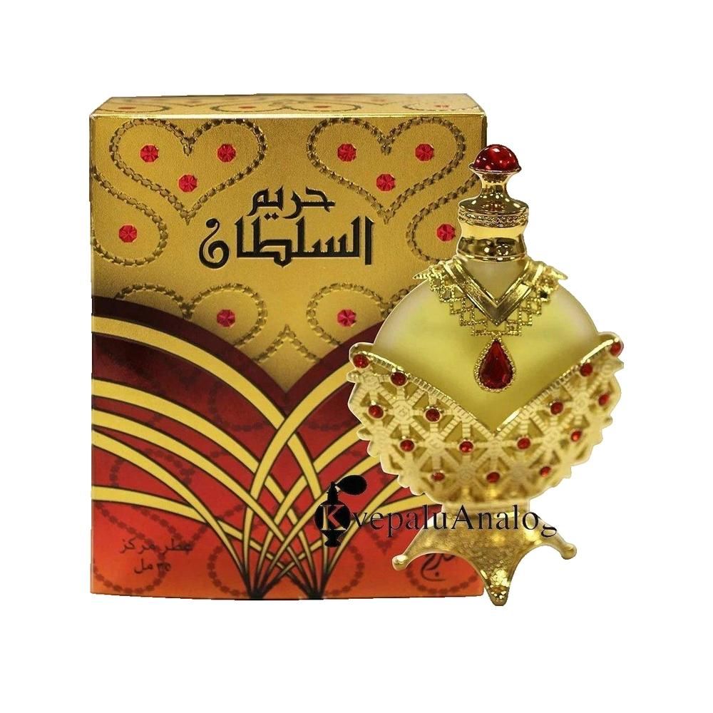 Goldfarbene Flasche mit rotem Schmuck und Karton. Aufschrift: HAREEM AL SULTAN. Konzentriertes Ölparfüm.