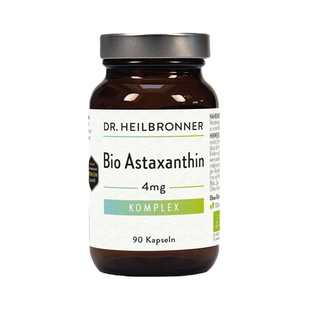 Braune Glasflasche mit Kapseln. Etikett mit "Bio Astaxanthin Komplex 4mg". 90 Kapseln. Bio- und Vegan-Siegel.