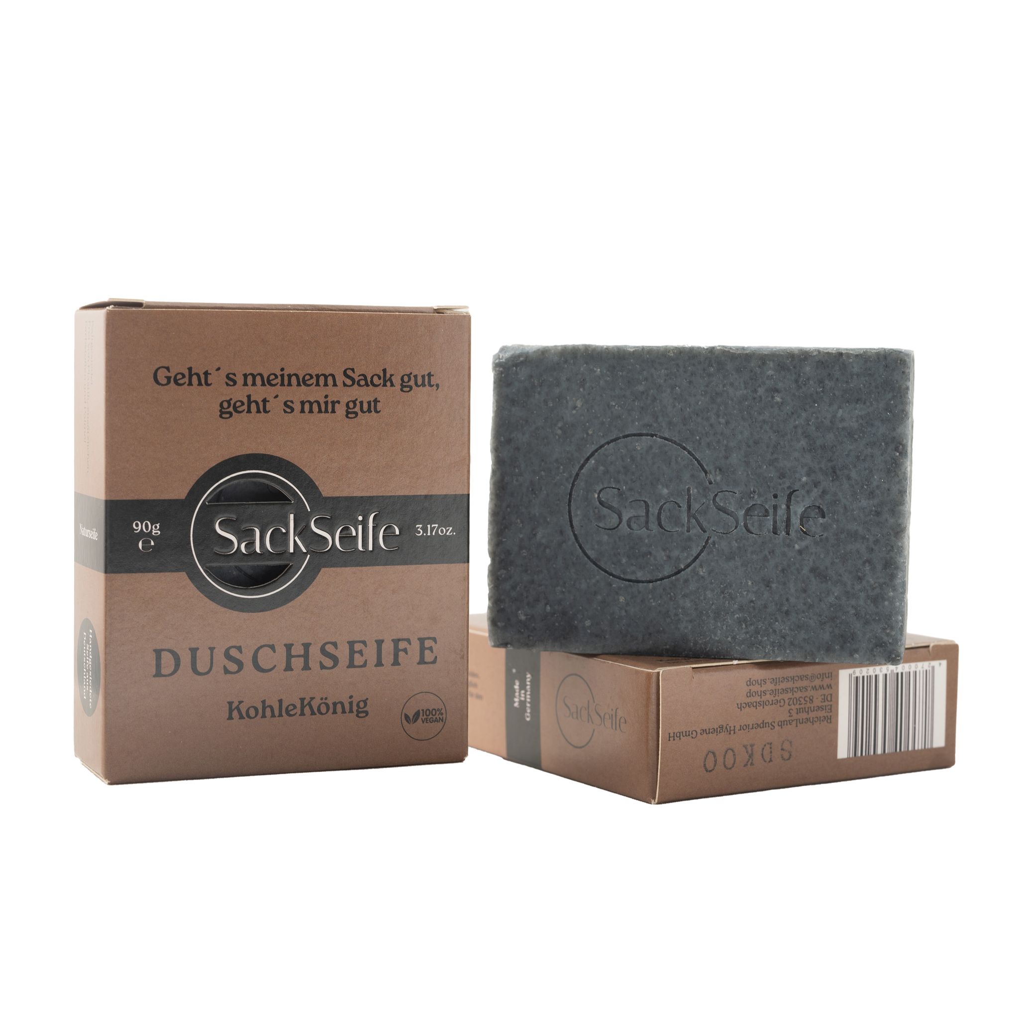 Duschseife und Verpackung. Rechteckige Seife mit SackSeife-Logo. Karton mit Produktname und Text. Vegan-Siegel.