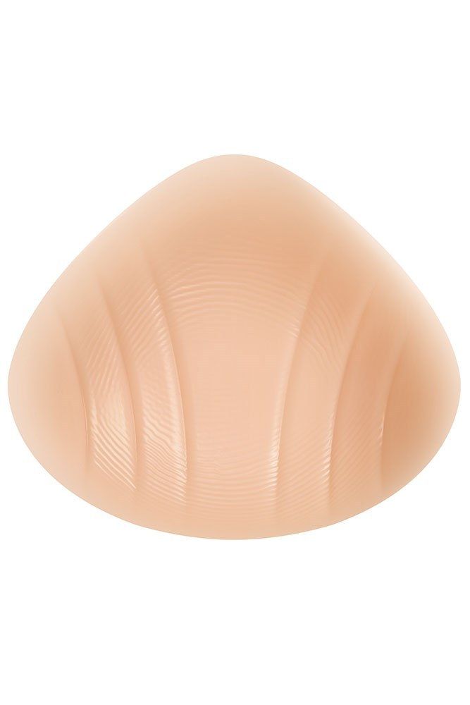 Hautfarbene, tropfenförmige Brustprothese. Mit geriffelter Oberfläche.