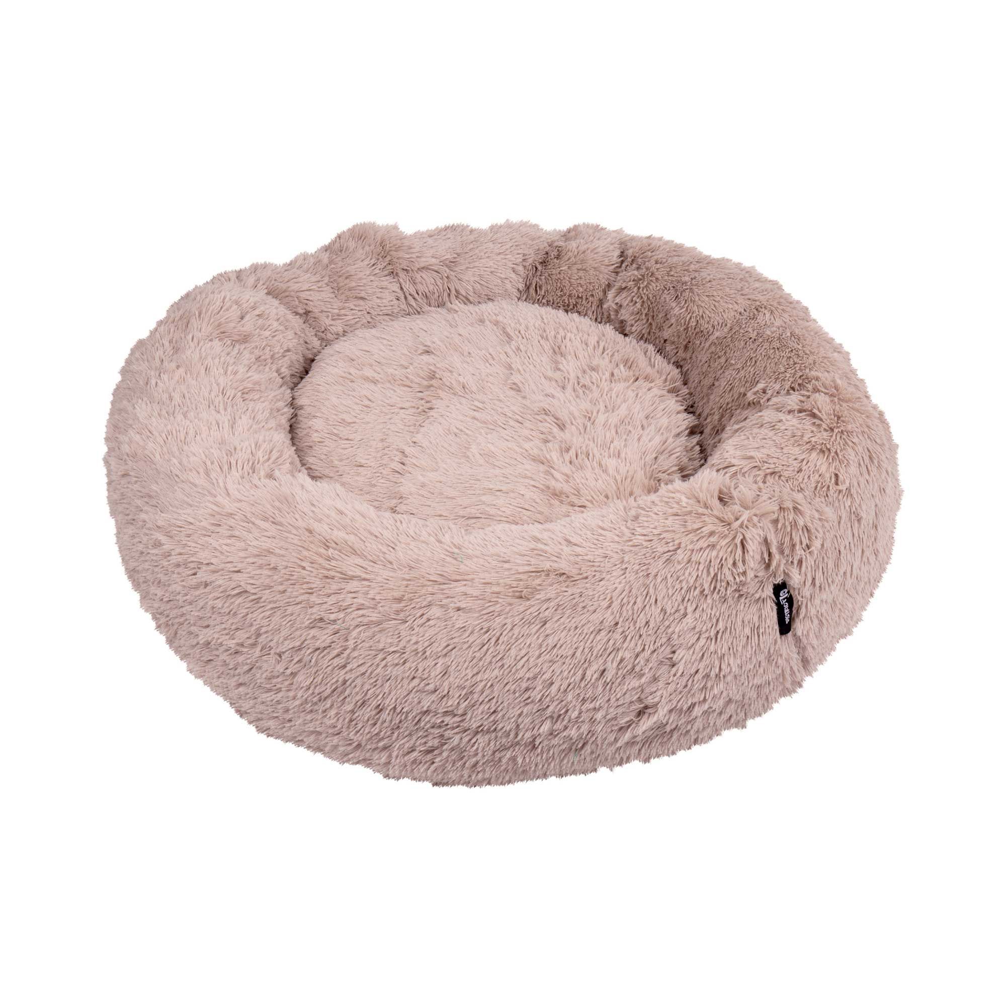 Rundes Hundebett, beige, mit hohem Rand und weicher Oberfläche. Kleines schwarzes Label am Rand.