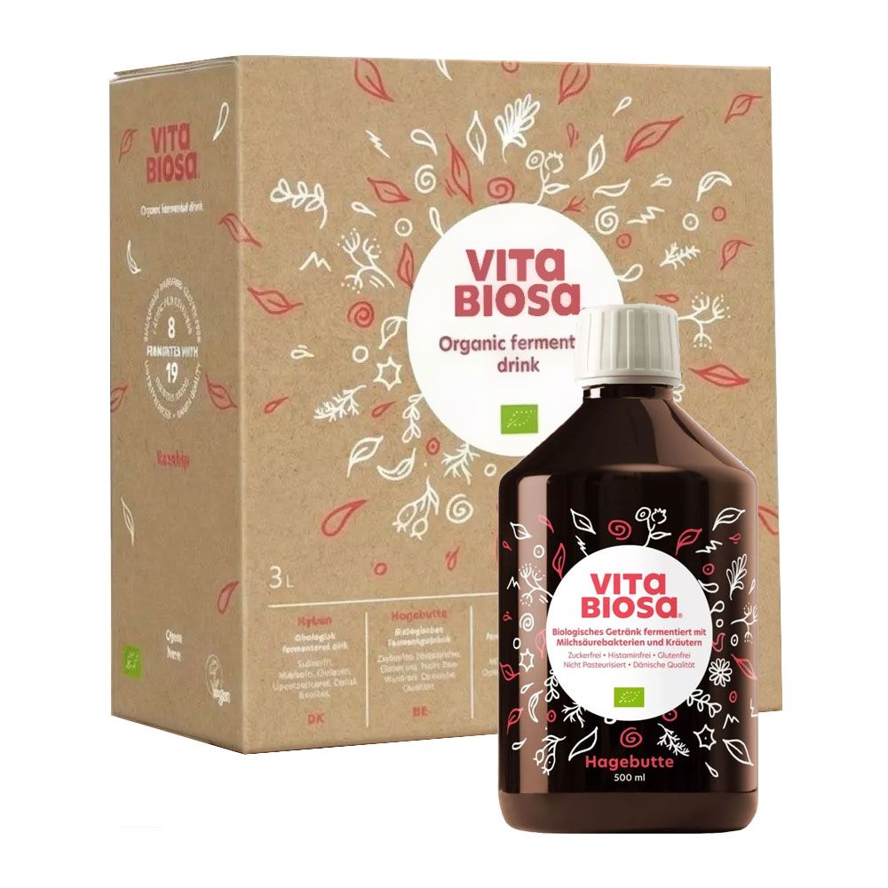 Vita Biosa Hagebutte Bio-Fermentgetränk in brauner Glasflasche mit weißem Deckel, neben einer Pappbox mit Produktinformationen.
