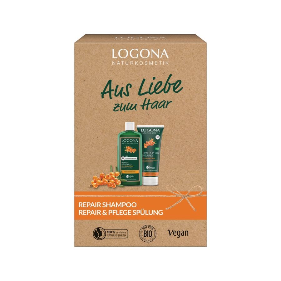 Geschenkset mit Shampoo und Spülung in einer braunen Box. Aufschrift: Aus Liebe zum Haar. Logo und Produktnamen sichtbar.