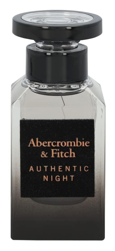 Glasflakon mit schwarzem Verschluss. Schwarzes Etikett mit weißer Schrift: Abercrombie & Fitch, Authentic Night. Farbverlauf von klar zu dunkel.
