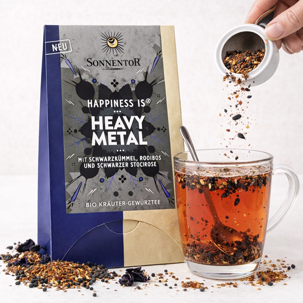 SonnenTor Heavy Metal Tee Schachtel, Tasse Tee und loser Tee.