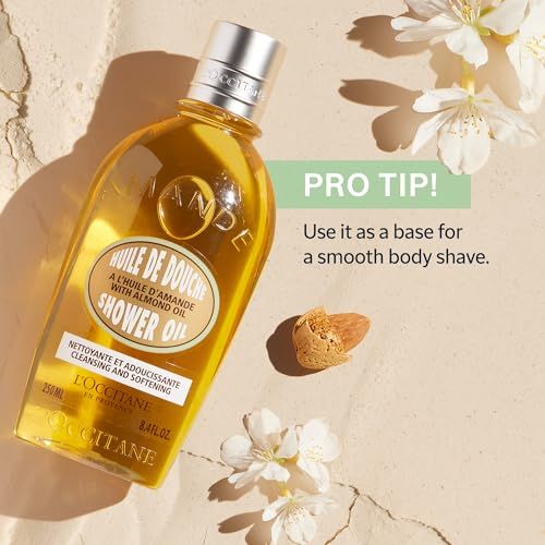 Gelbe Flasche mit Pumpe. Aufschrift: Huile de Douche, Shower Oil, L'Occitane. Blüten und Mandel daneben.