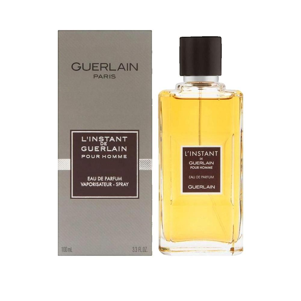 Guerlain L'Instant de Guerlain pour Homme Eau de Parfum Flakon und Verpackung. Rechteckige Flasche, graue Verpackung.