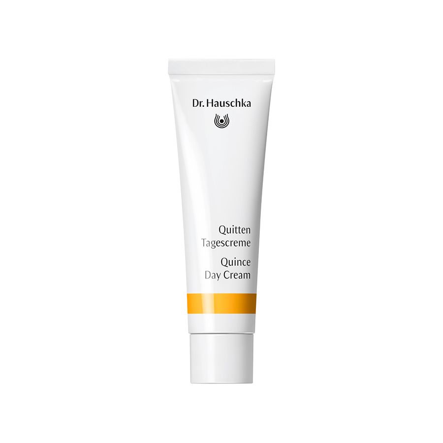 Weiße Tube mit Aufschrift Dr. Hauschka, Quitten Tagescreme, Quince Day Cream. Gelber Streifen.
