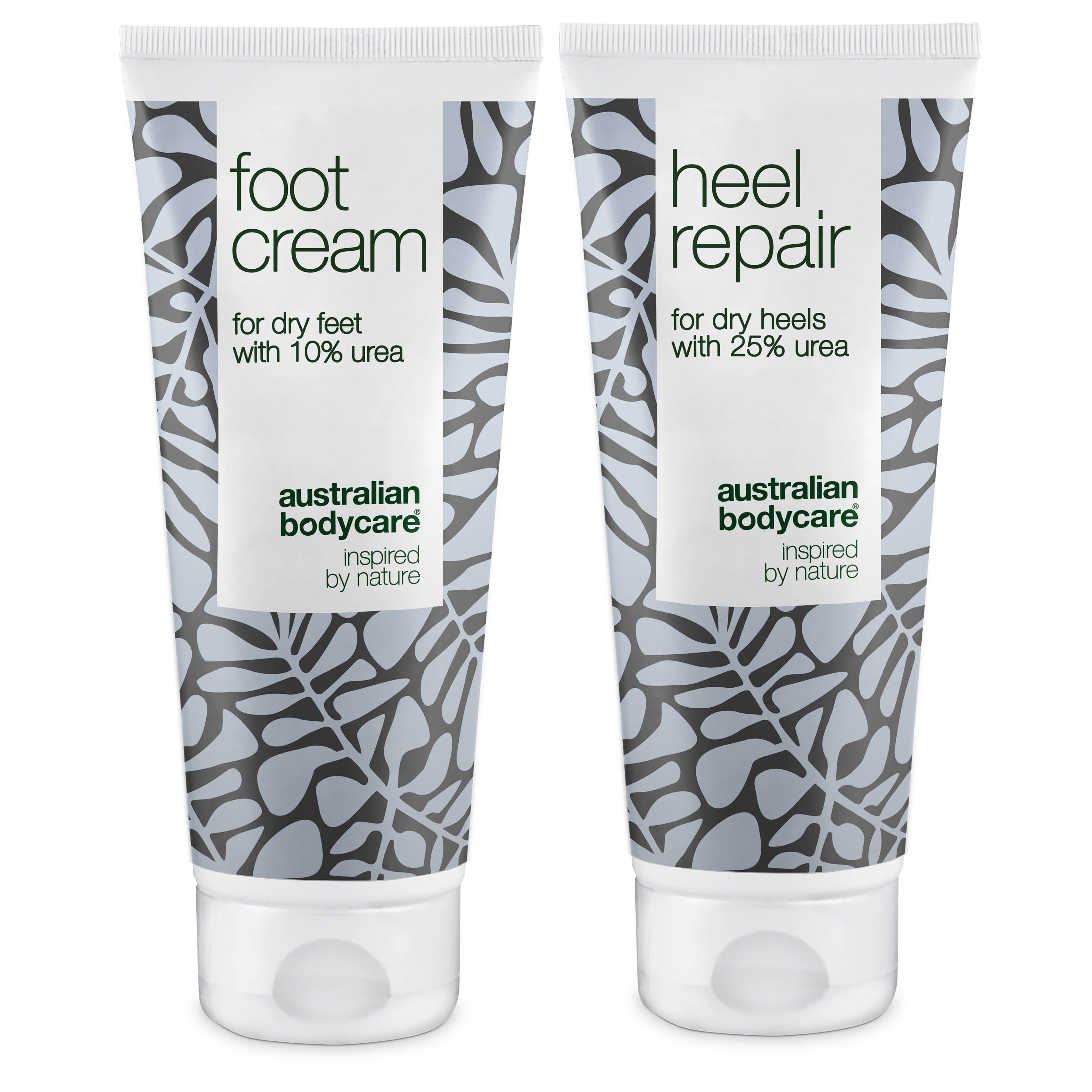 Zwei Tuben Fußcreme und Fersenreparatur. Weiße Tuben mit floralem Muster und Produktinformationen.