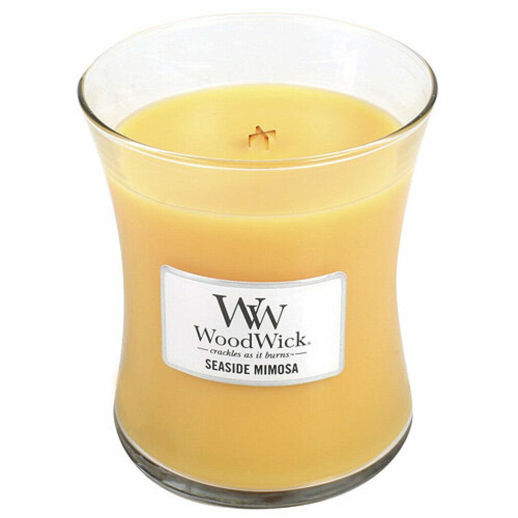 Kerze in Sanduhrform. Aufschrift: WoodWick Seaside Mimosa. Gelbes Wachs in Glasbehälter. Holzdocht sichtbar.