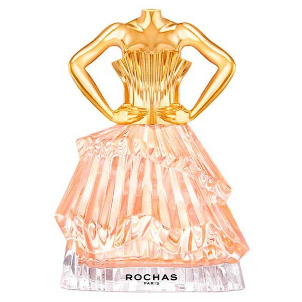 Parfümflakon in Form eines Kleides. Goldfarbener Oberteil, rosa Rock. Aufschrift: ROCHAS PARIS.