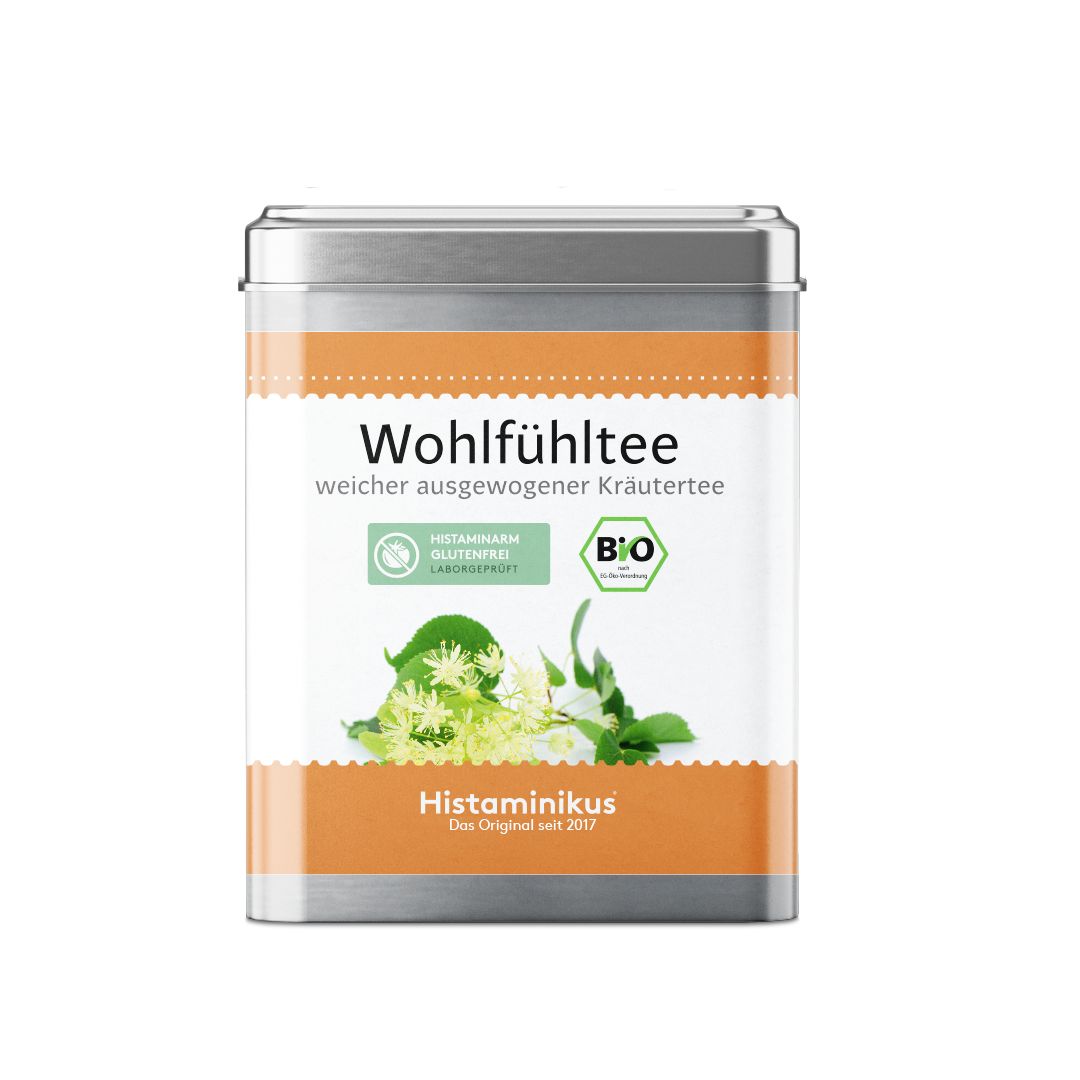 Metallbox mit Aufschrift Wohlfühltee, Bio-Siegel und Kräuterabbildung. Text: Histaminikus, glutenfrei.
