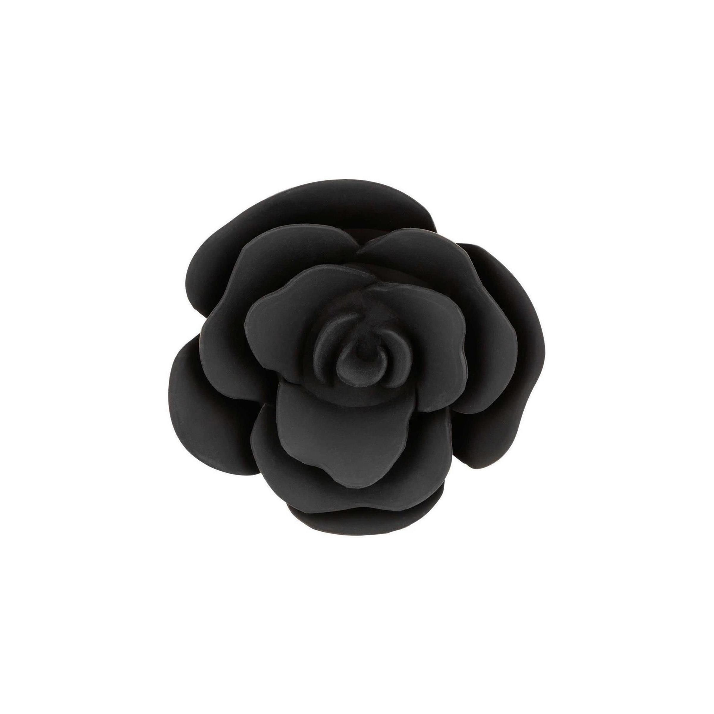 Schwarzer Anal Plug in Rosenform, von oben fotografiert.