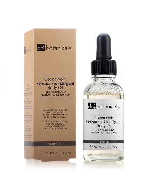 Körperöl mit Verpackung. Flasche mit Pipette und Karton. Aufschrift: Cocoa Noir Sensuous & Indulgent Body Oil.