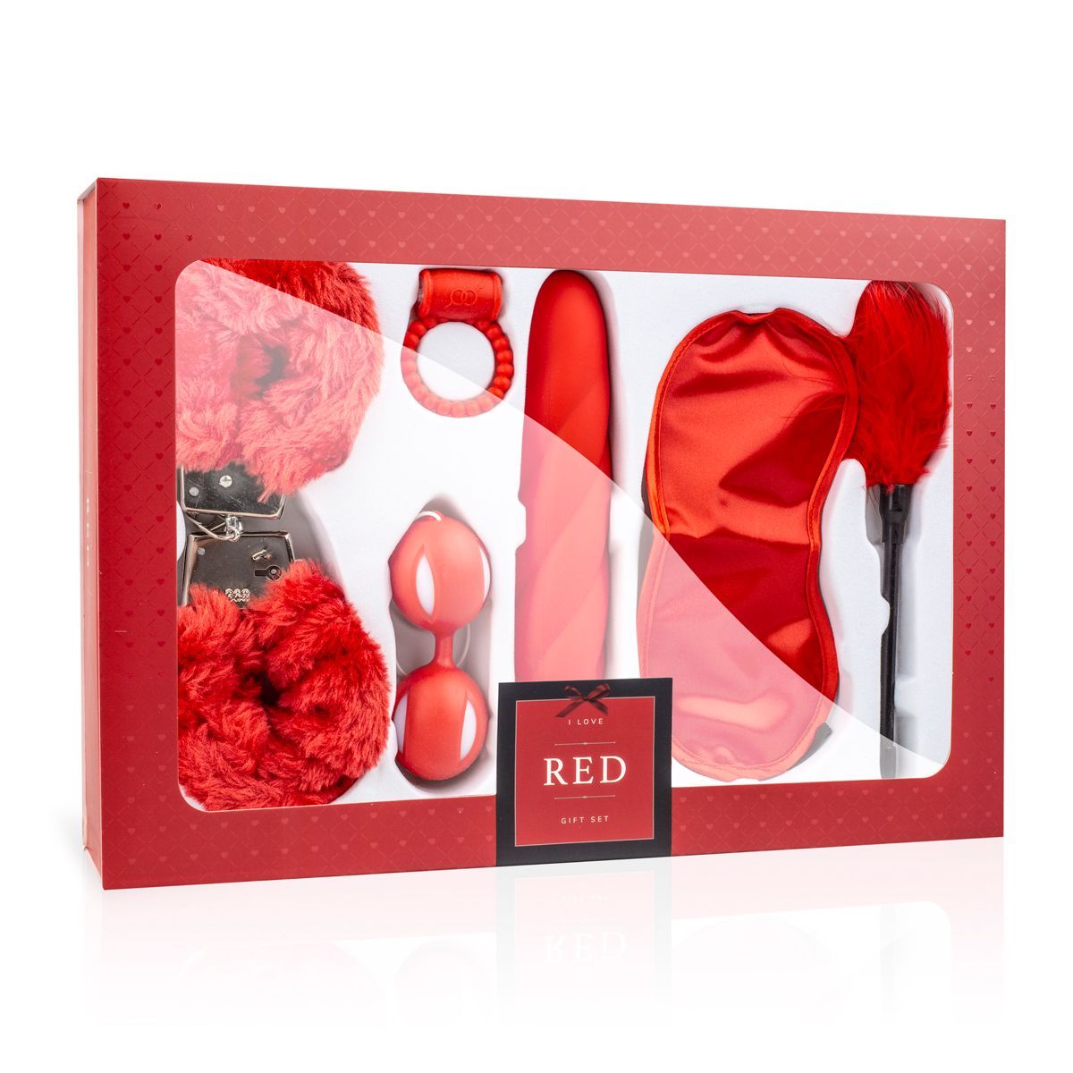 Rode geschenkdoos met accessoires: boeien, ring, vibrator, oogmasker, veerwaaier.