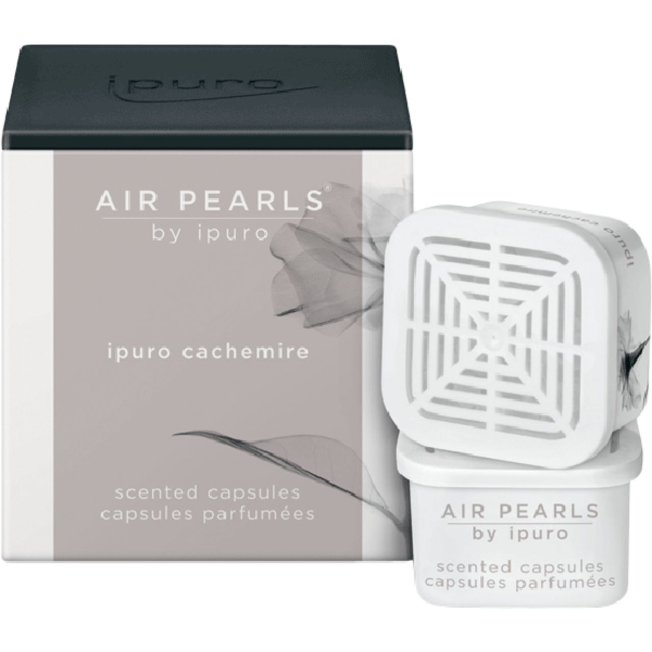 Verpackung und Kapseln. Auf der Verpackung: "AIR PEARLS by ipuro", "ipuro cachemire", "scented capsules". Weiße Kapseln.