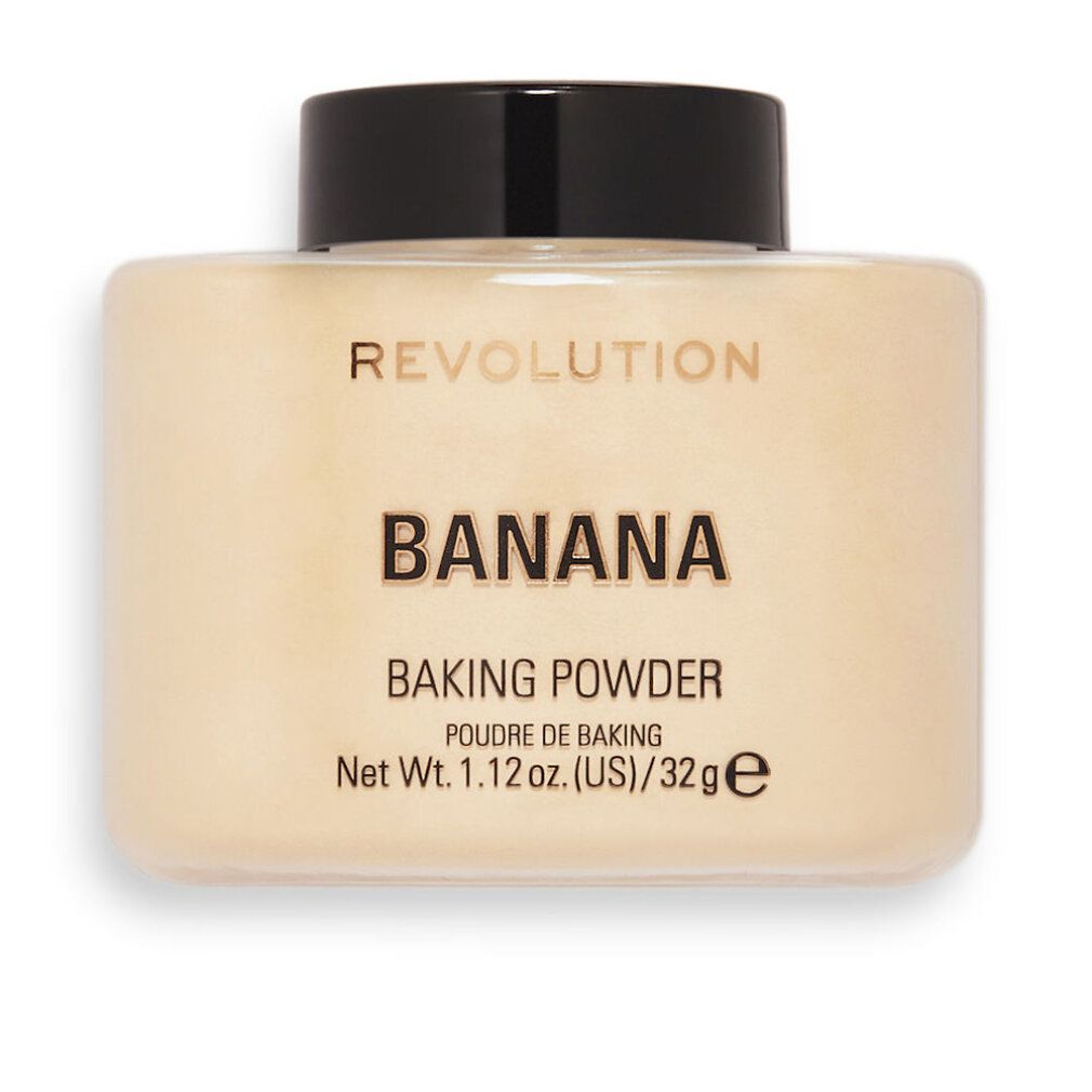 Beige Puderbehälter mit schwarzem Deckel. Aufschrift: REVOLUTION, BANANA, BAKING POWDER, Net Wt. 1.12 oz. (US)/32g e.