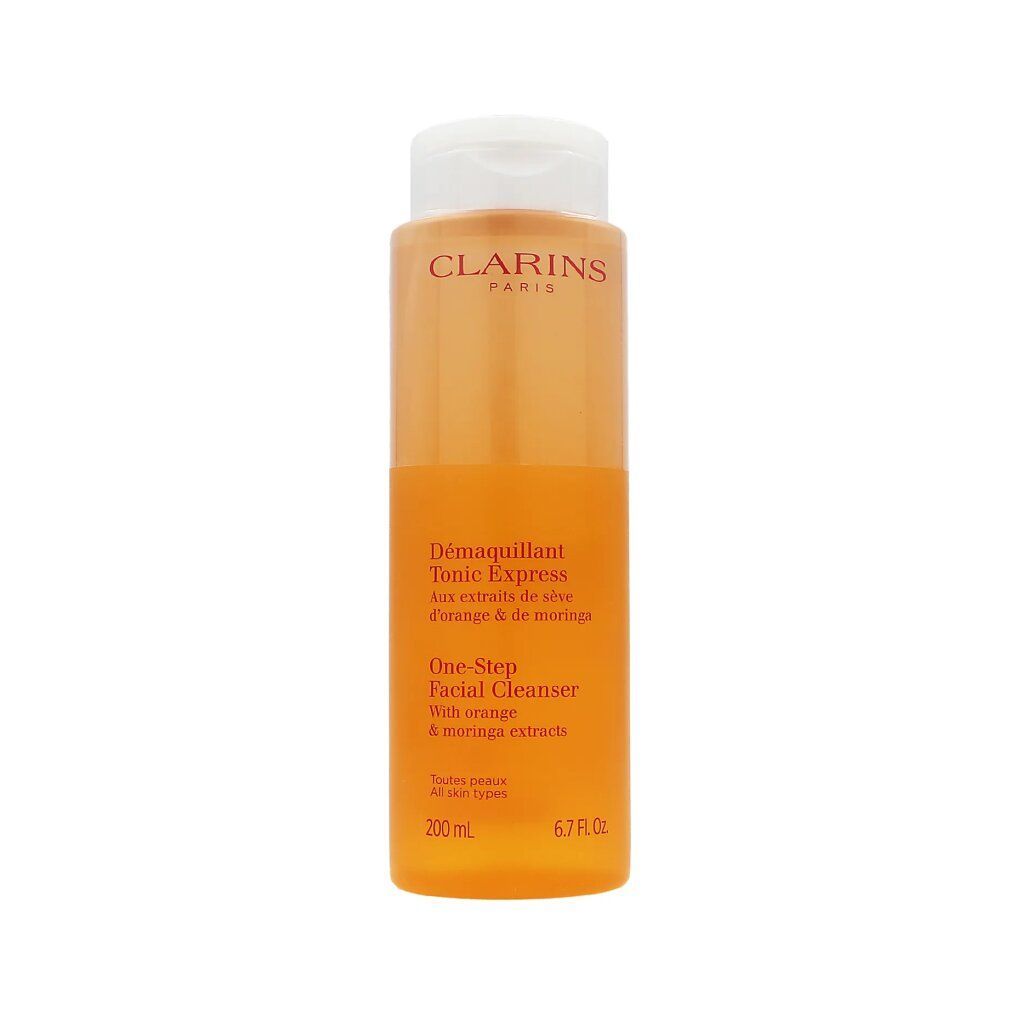 Clarins Tonic Express Flasche. Orangefarben, mit weißem Deckel. Text auf dem Etikett.