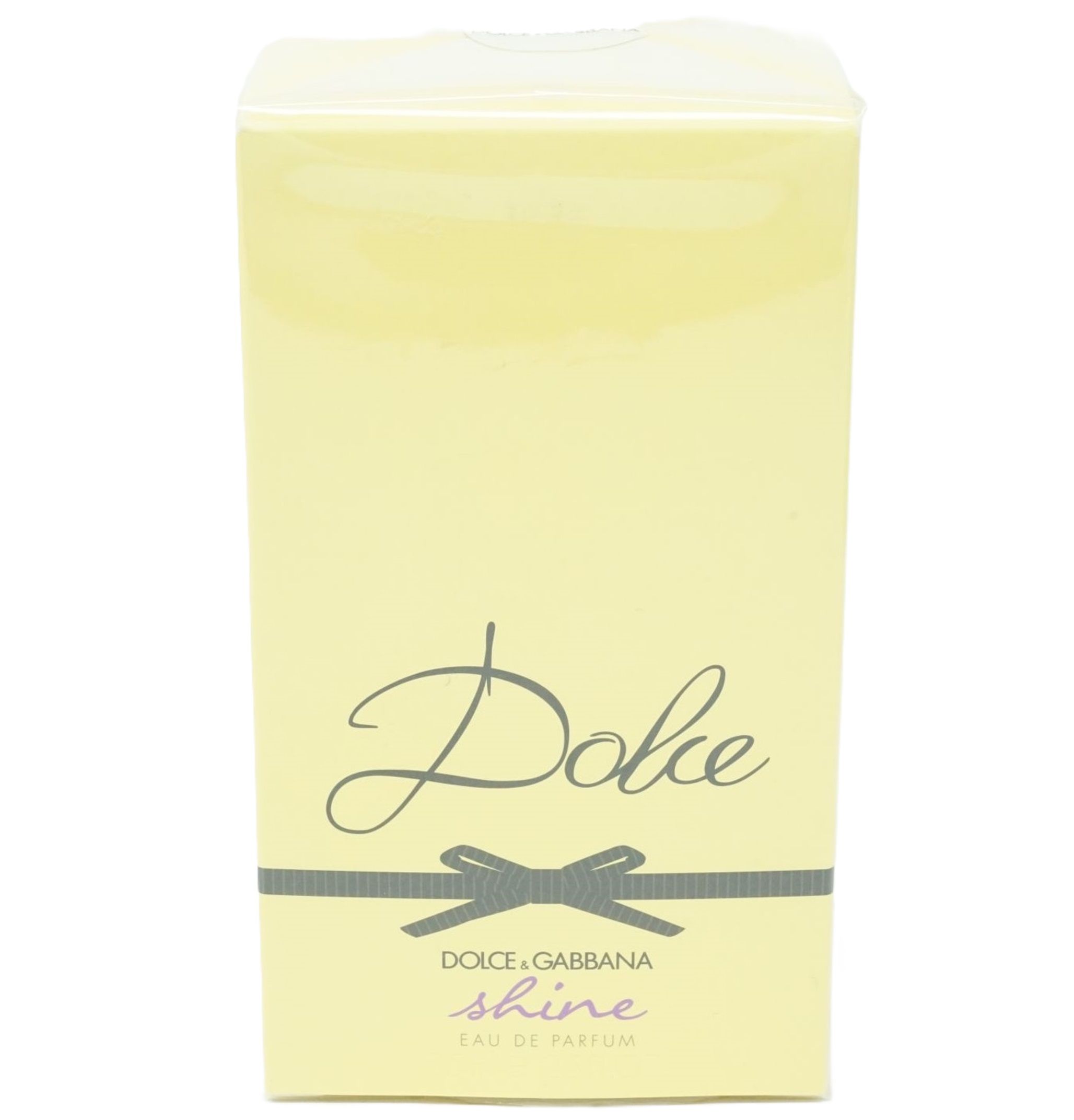 Gelbe Verpackung mit "Dolce"-Schriftzug, Schleife und "Dolce & Gabbana Shine Eau de Parfum".