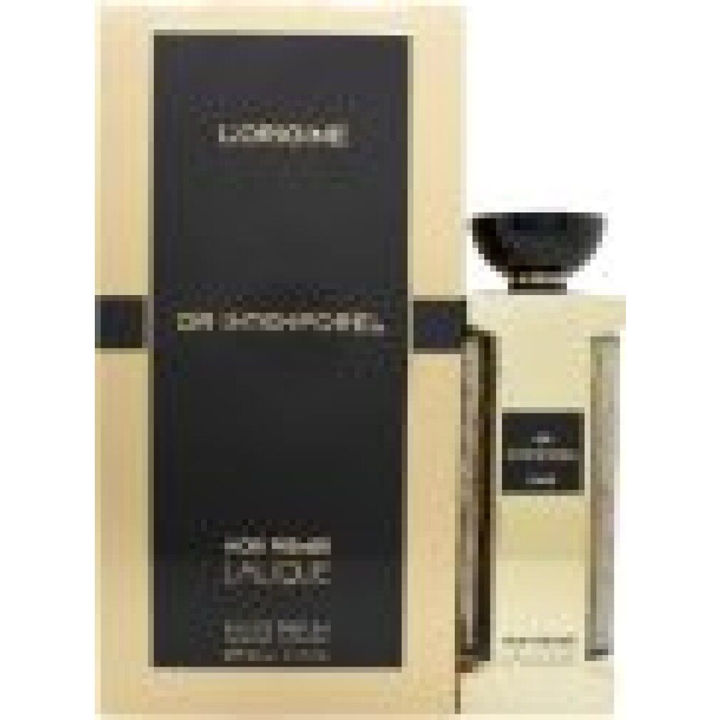 Goldfarbener Flakon und Verpackung. Schwarzer Deckel. Text: L'ORIGINE, OR INTEMPOREL, NOIR PREMIER, LALIQUE. Eau de Parfum.