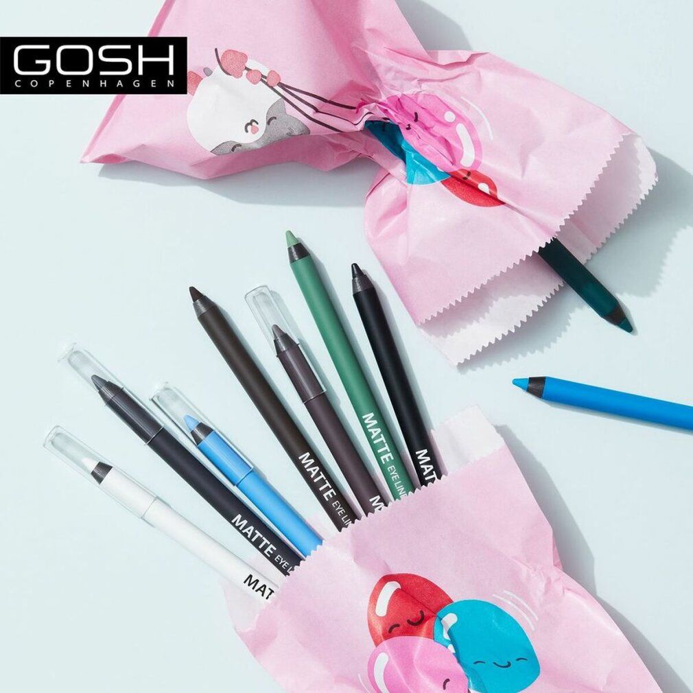 Mehrere Gosh Matte Eyeliners in verschiedenen Farben in rosa Papiertüten. Marke Gosh.