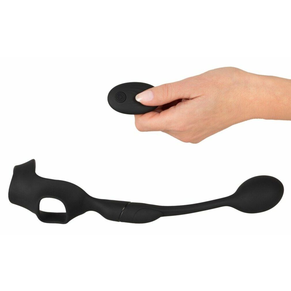 Schwarzes Produkt mit Ring, gebogener Stange und ovalem Ende. Hand hält Fernbedienung.