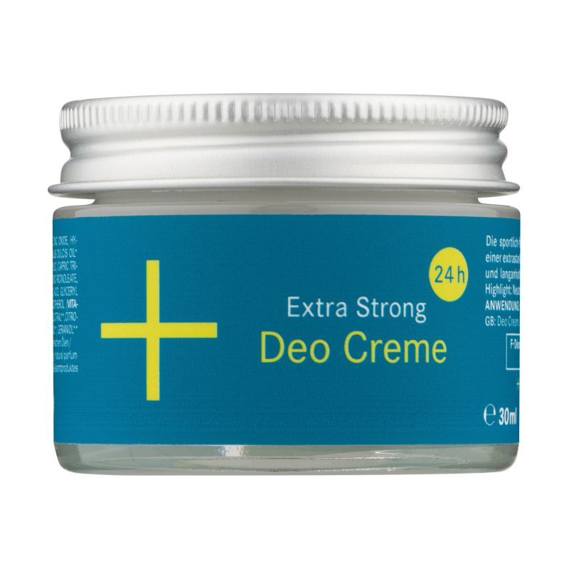 Deocreme in einem Glasbehälter mit silbernem Deckel. Aufschrift: Extra Strong Deo Creme. Logo: Gelbes Kreuz auf blauem Grund. 24h.