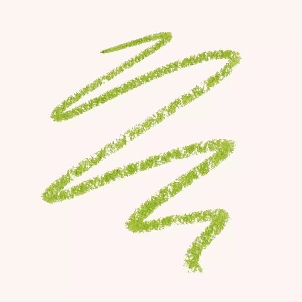 Grüner Kajalstrich auf hellem Hintergrund. Zickzack-Form. Textur sichtbar.