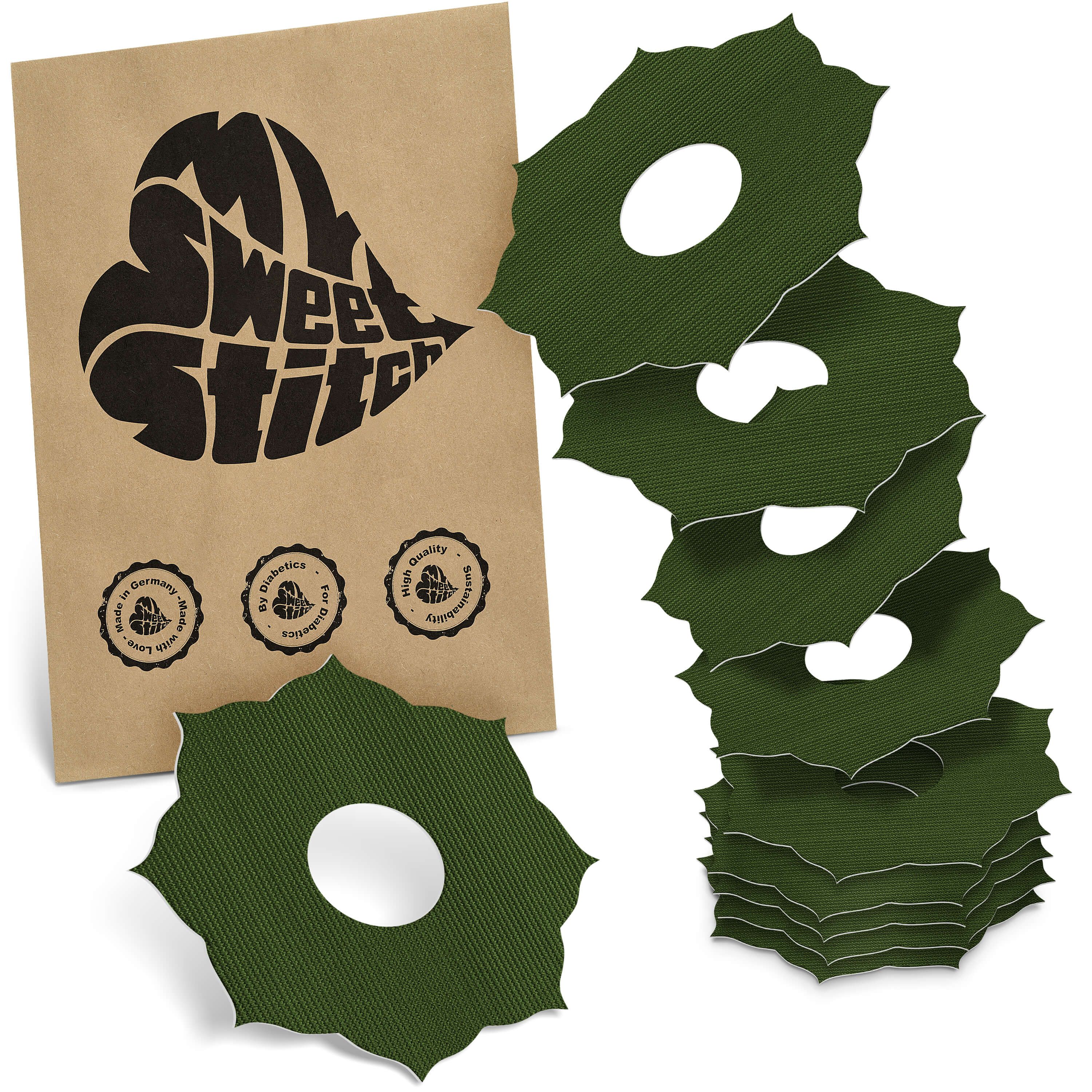 Grüne Ringpflaster mit Loch in Blattform. Verpackung mit Logo 'MySweetStitch' und Qualitätssiegeln. Mehrere Pflaster gestapelt.