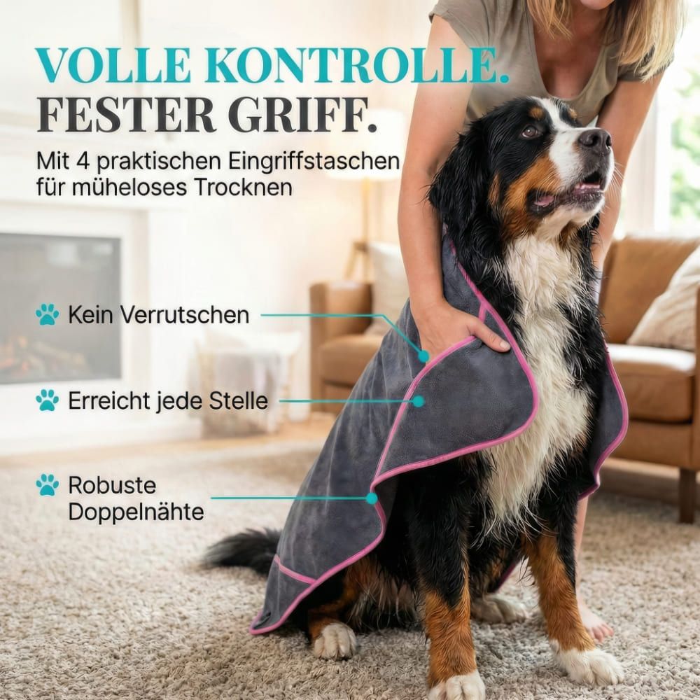 Graues Hundehandtuch mit rosa Einfassung. Hund wird abgetrocknet. Text: Volle Kontrolle. Fester Griff. Mit 4 Eingriffstaschen.