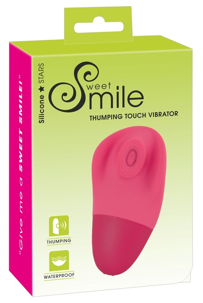 Verpackung mit Produkt. Aufschrift: Sweet Smile, Thumping Touch Vibrator. Rosa Vibrator, grün-weiße Verpackung.
