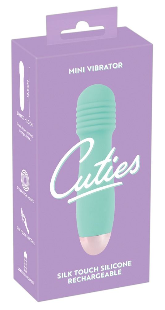 Mintgrüner Cuties Groove Mini Taschenvibrator wird über Ladekabel aufgeladen.