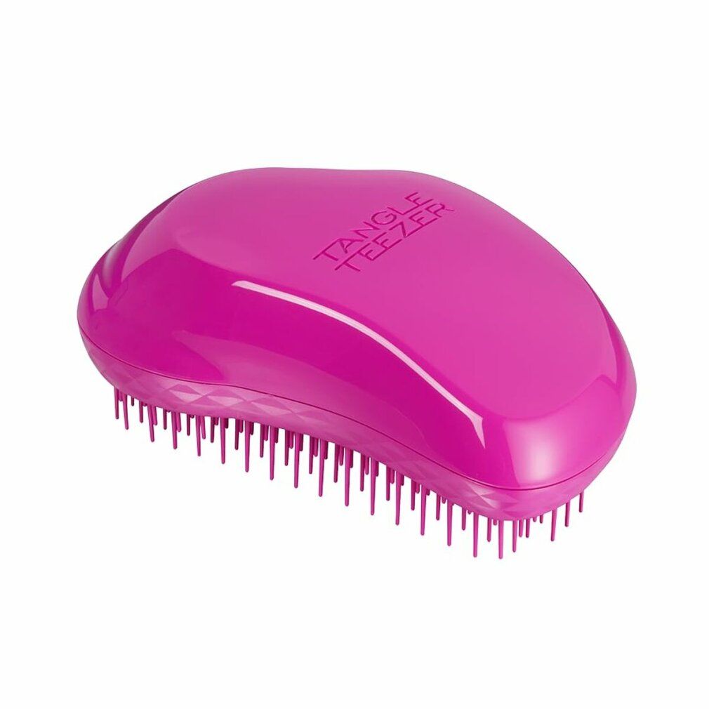 Rosa Haarbürste. Aufschrift: Tangle Teezer. Ergonomische Form mit Stiften.