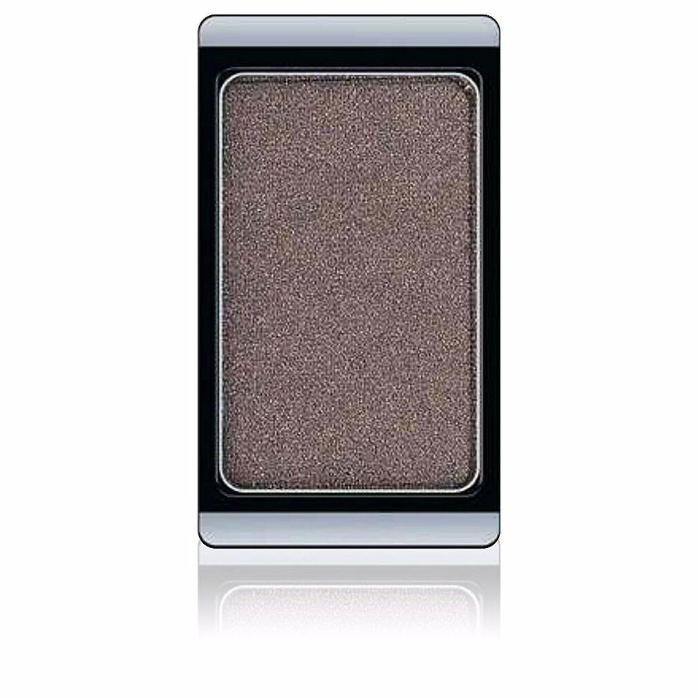 Lidschatten in rechteckiger Form. Farbe: Braun mit Glitzer. Schwarzer Rahmen, silberner Rand.
