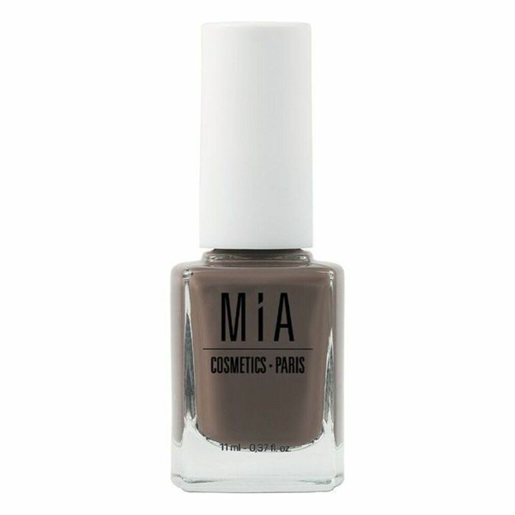Nagellackflasche mit brauner Farbe und weißem Deckel. Aufschrift: Mía Cosmetics Paris. Volumen: 11 ml.