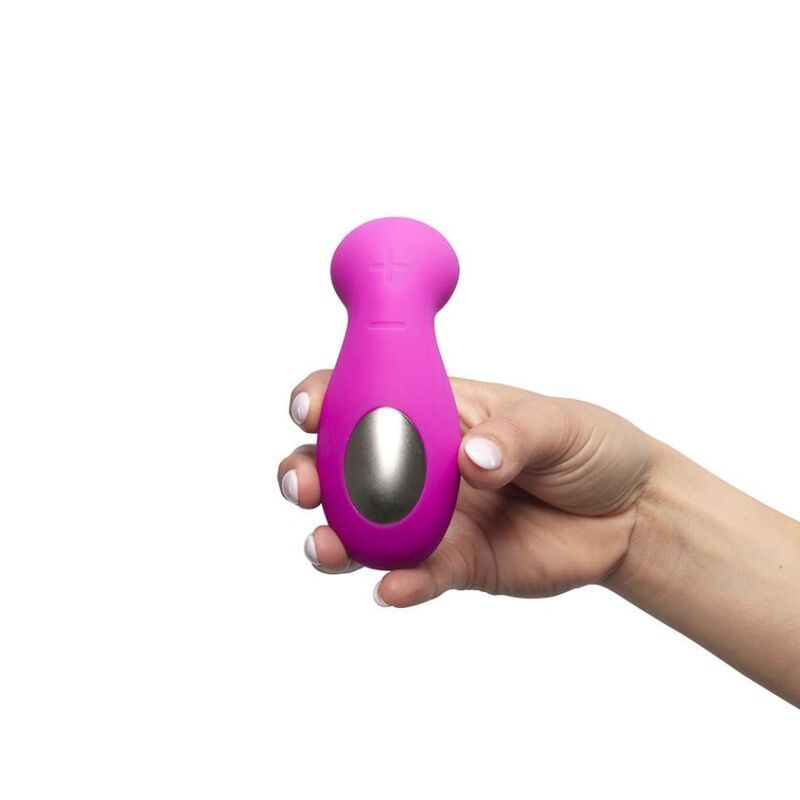 Pinkfarbenes Gerät mit ovalem, silberfarbenem Bereich und abgerundeter Form. Wird von einer Hand gehalten.