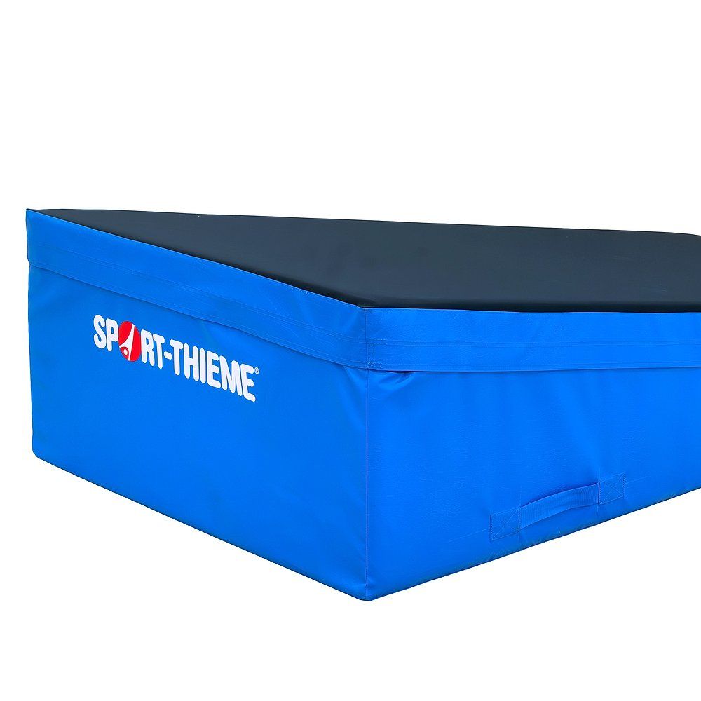Blau-schwarze Keilmatte. Sport-Thieme Logo. Griff an der Seite.
