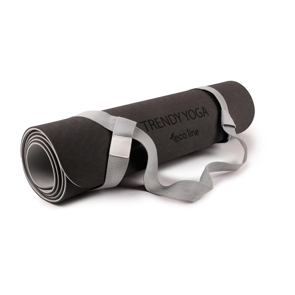 Gerollte dunkelgraue Yogamatte mit Tragegurt. Text auf Matte: TRENDY YOGA eco line.