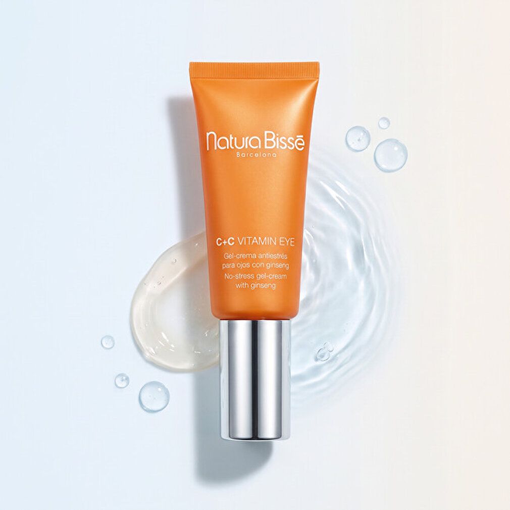 Orange Tube mit silbernem Verschluss, Natura Bissé C+C Vitamin Eye No-Stress Gel-Cream mit Ginseng, auf Wasser.