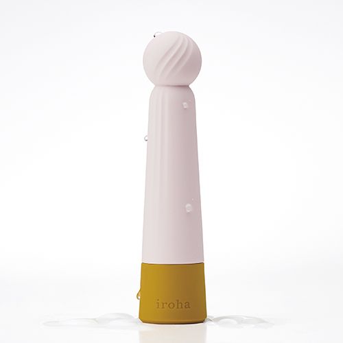Wellness-Produkt mit Kugelspitze. Rosa, weiß und goldfarben. Wassertropfen. Aufschrift "iroha".