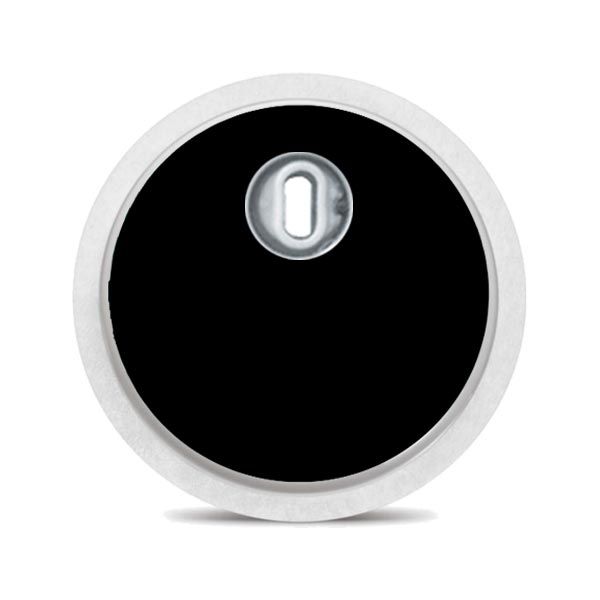 Runder schwarzer Aufkleber mit weißem Rand und einer Öffnung in der Mitte. Für ein medizinisches Gerät.