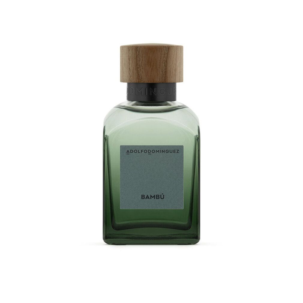 Grüne Glasflasche mit Holzdeckel. Auf dem Etikett steht "ADOLFO DOMINGUEZ BAMBÚ".