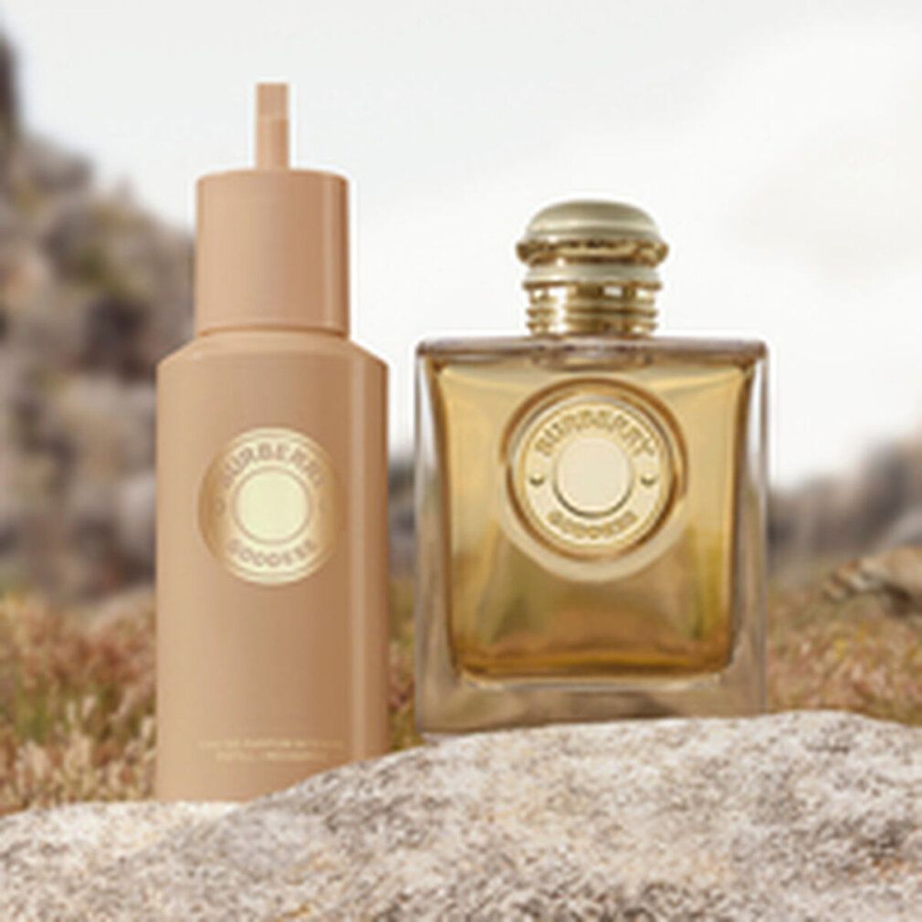 Zwei goldfarbene Flakons. Aufschrift Burberry Goddess. Ein Flakon mit Sprühkopf.